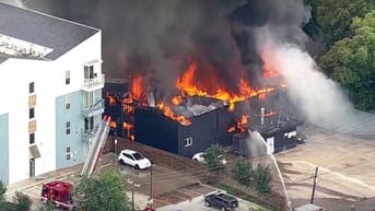 Massive black smoke plume rises over apartment building after major explosion - Fox News