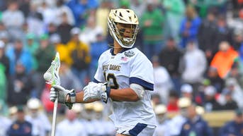 Notre Dame's Josh Yago salutes during anthem before title game on Memorial Day - Fox News
