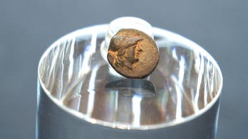 Teen stumbles on mysterious coin from legendary city, puzzling archaeologists over its journey