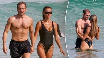 Brooks Nader flaunts plunging swimsuit during steamy beach date with actor Taron Egerton in Australia
