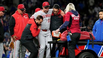 Reds closer carted off field after sustaining leg injury just one pitch into appearance
