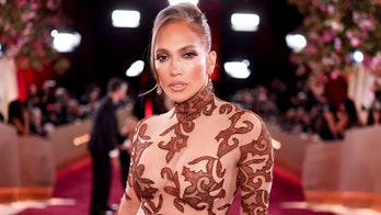 Jennifer Lopez flashes her toned abs in tiny white bikini as she enjoys pool time session