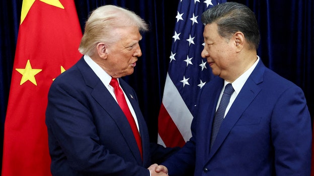 Donald Trump shakes hands with Xi Jinping