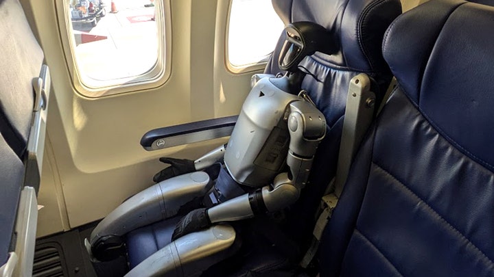 robot-sitting-plane.jpg