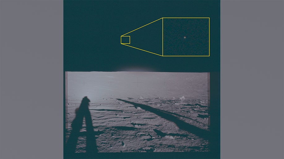 A view of the lunar horizon from the Apollo 12 landing site showing a highlighted area of interest positioned to the left of the center.