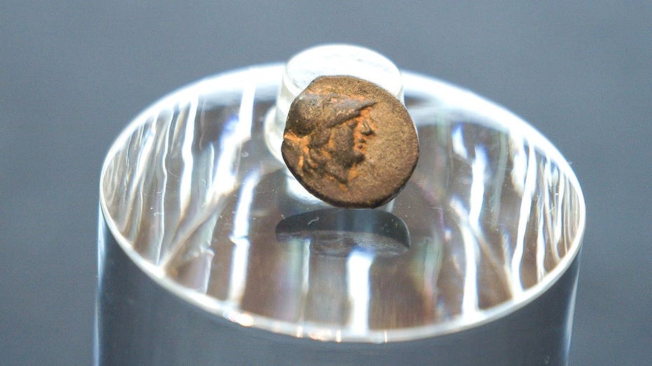 Teen stumbles on mysterious coin from legendary city, puzzling archaeologists over its journey