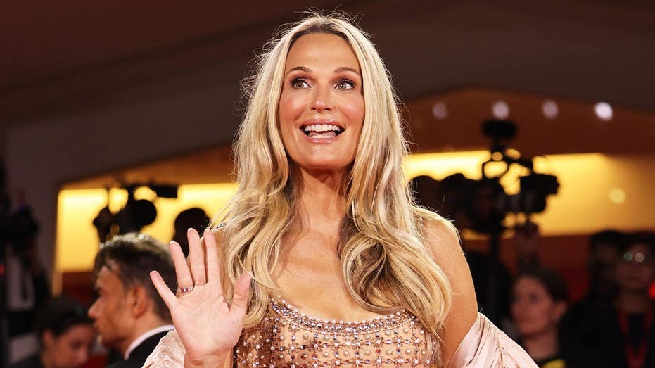 Molly Sims puts on a bikini and gets in the sand to dunk on those who told her modeling wouldn't last forever