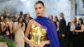 Hailey Bieber shows off toned abs in behind-the-scenes photos from new Rhode beach campaign - Fox News