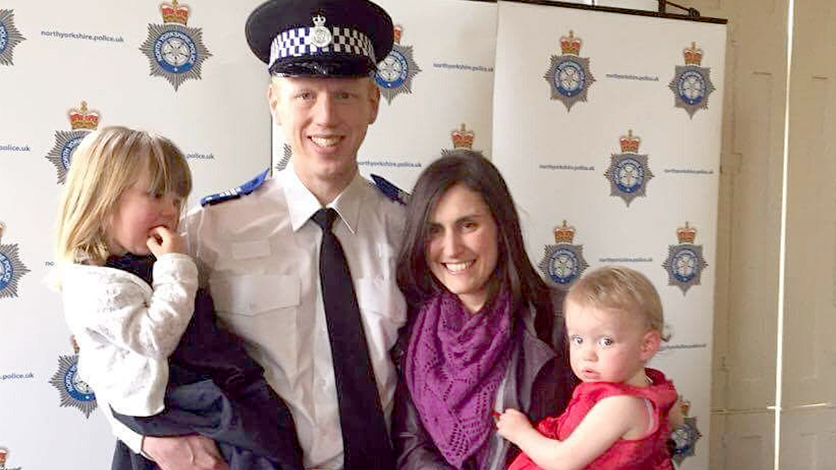 Luke Salmons poses with his wife and children