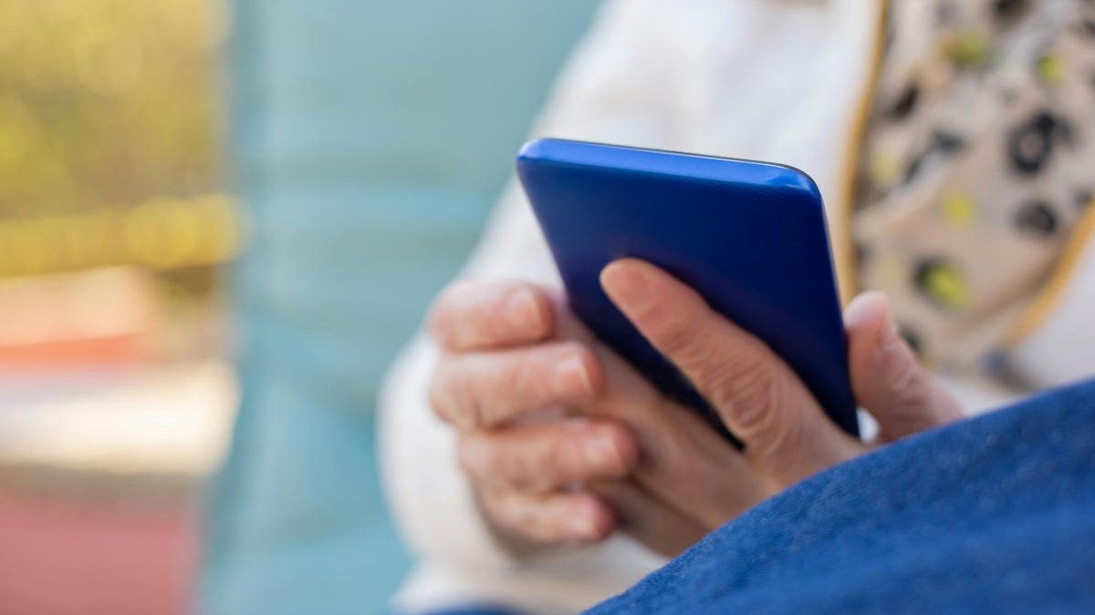 woman holding phone