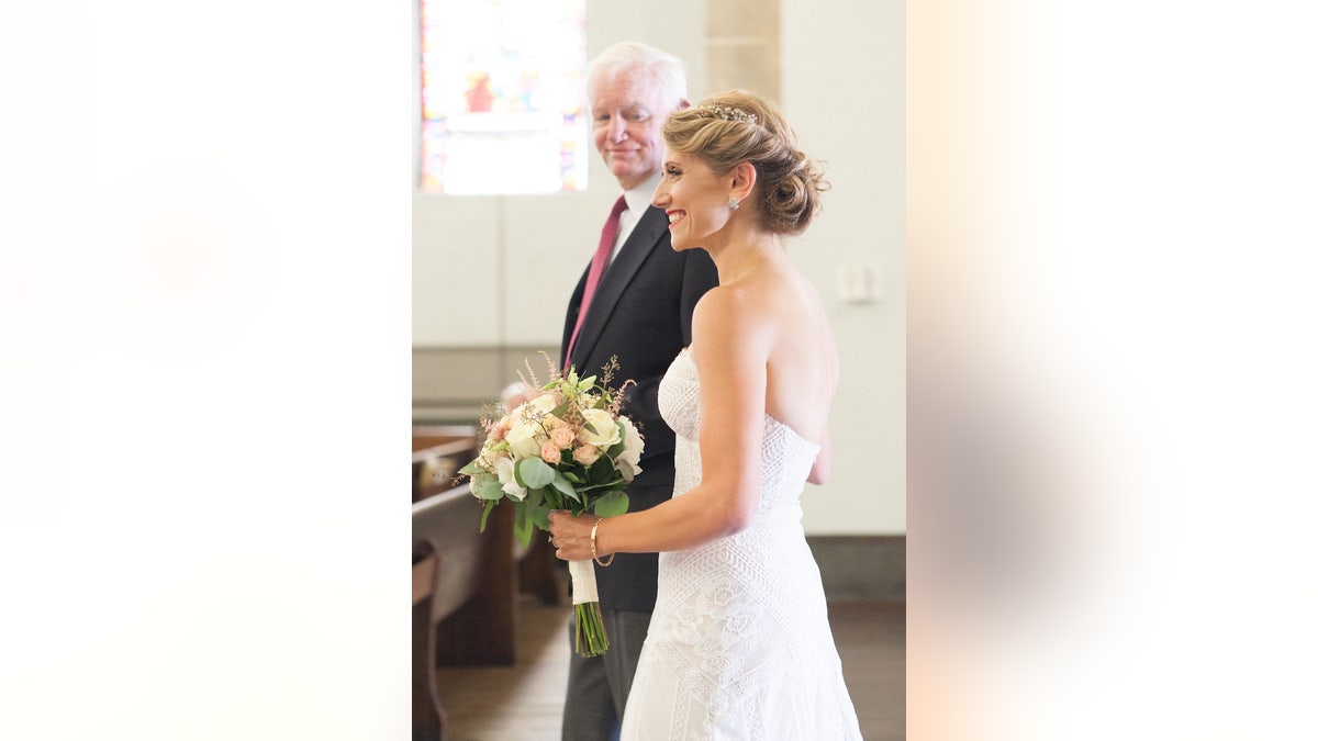Bride with father figure who has her deceased father's donated heart.