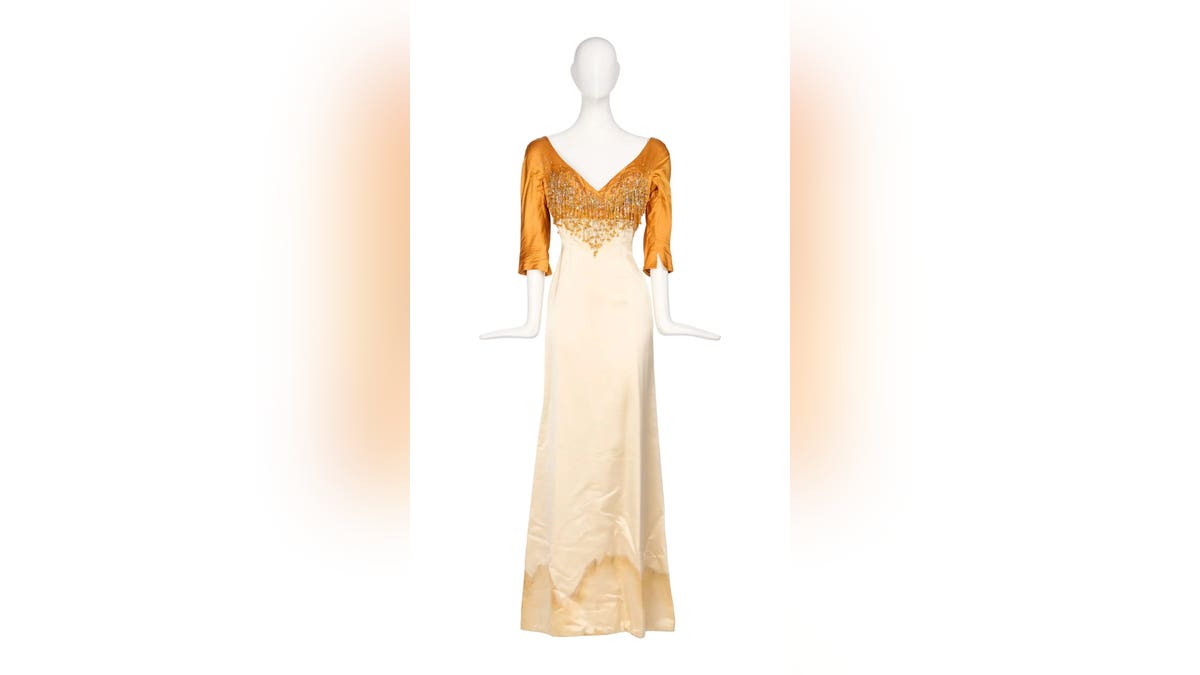 Ann-Margret gold and ivory dress.