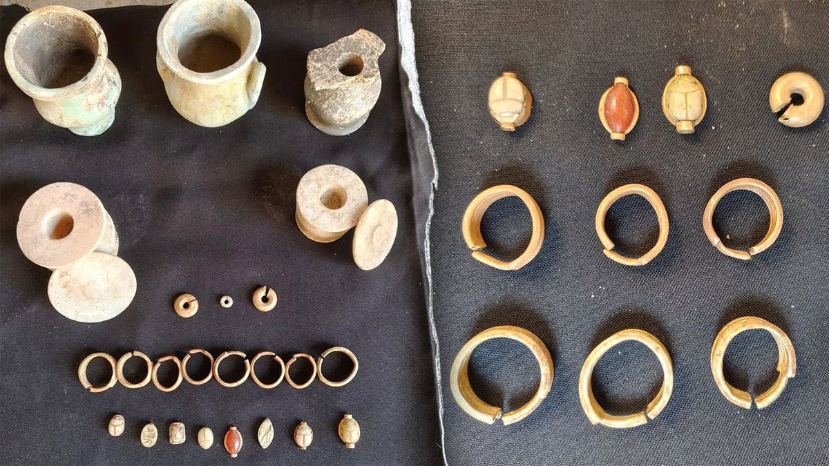 Split representation of past treasure recovered astatine site
