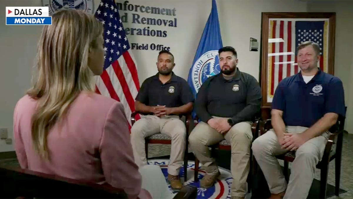Woman interviews three men