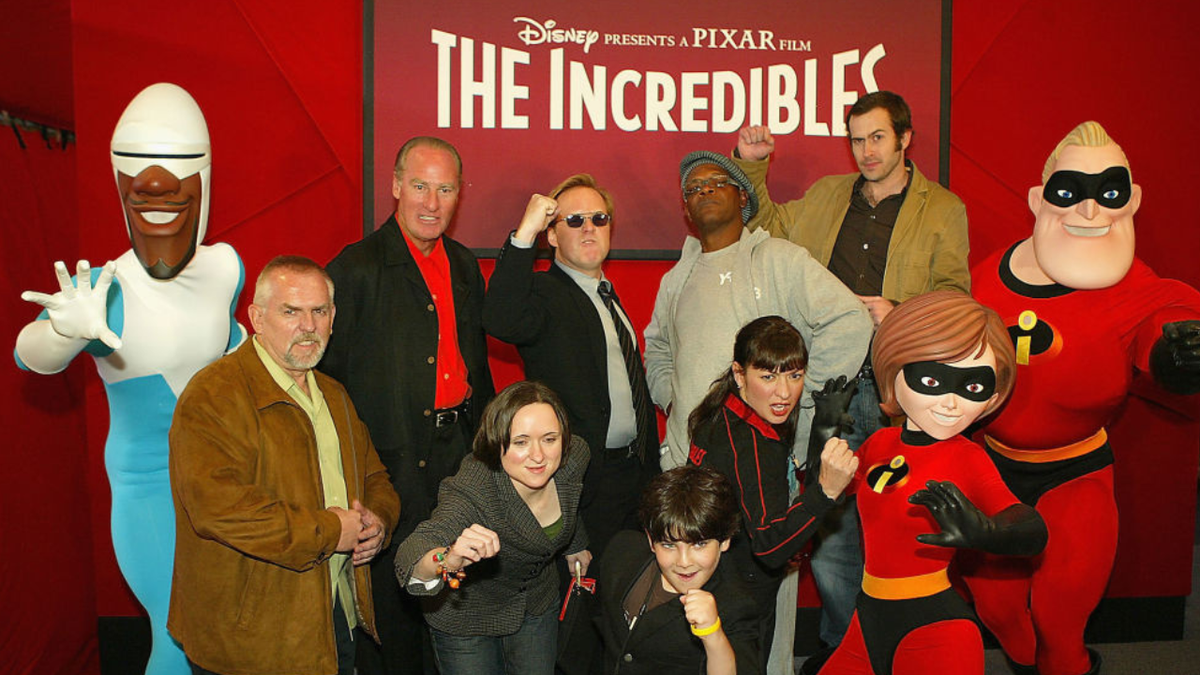 John Ratzenberger, Craig T. Nelson, Sarah Vowell, Brad Bird, Spencer Fox, Samuel L. Jackson, Elizabeth Pena and Jason Lee standing together at a premiere event