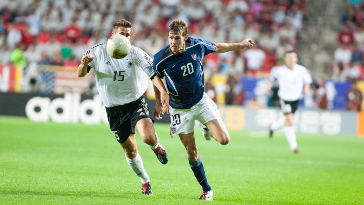 Brian McBride of USA and Sebastian Kehl of Germany competing during a soccer match at Munsu Football Stadium