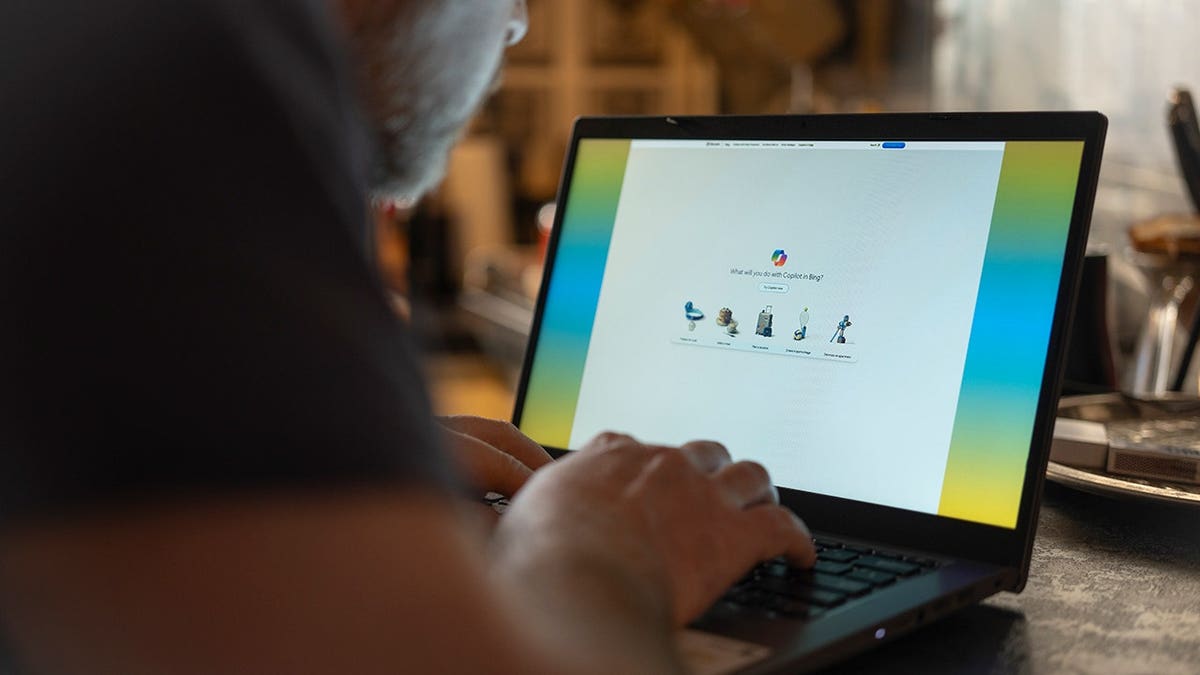 Person logging into a Microsoft account.