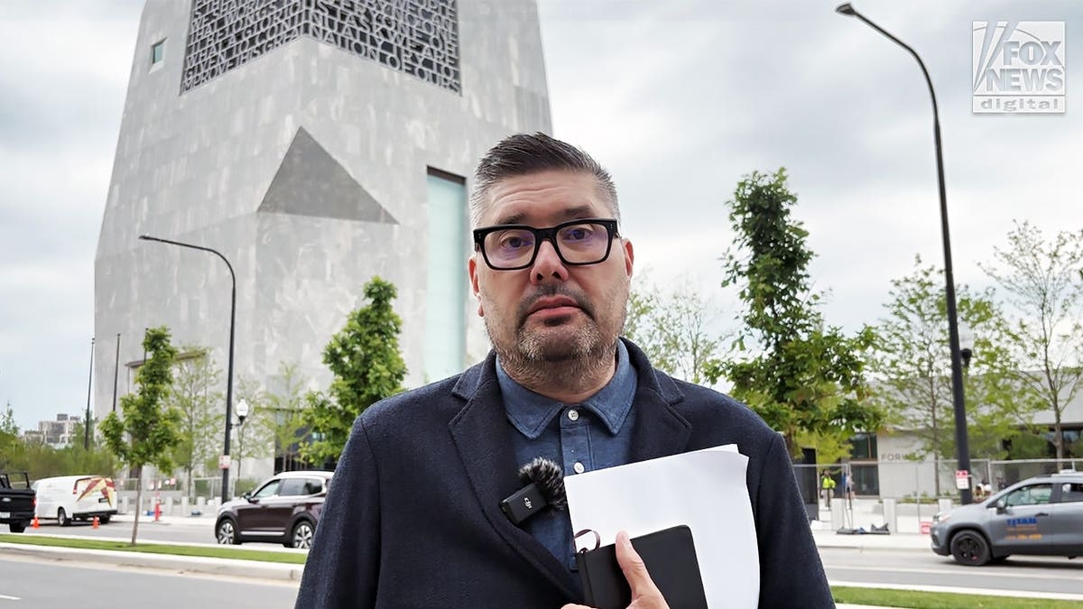 Mike Owen stands outside the Obama Presidential Center.