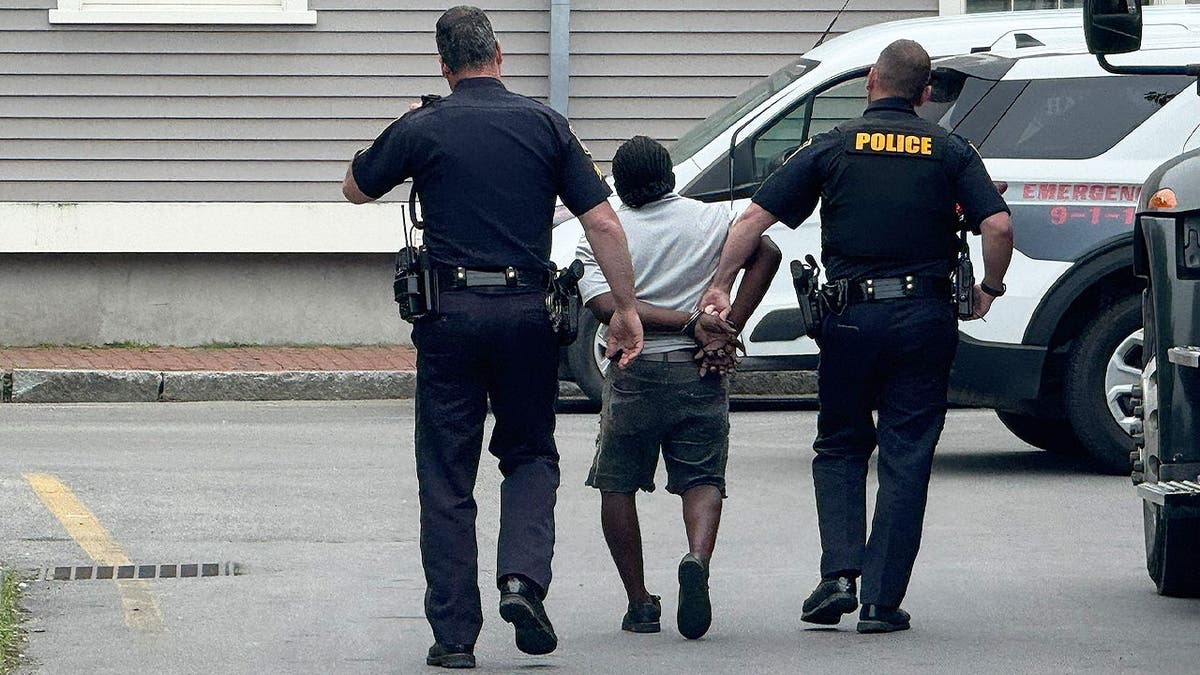 Kemar Downer being arrested