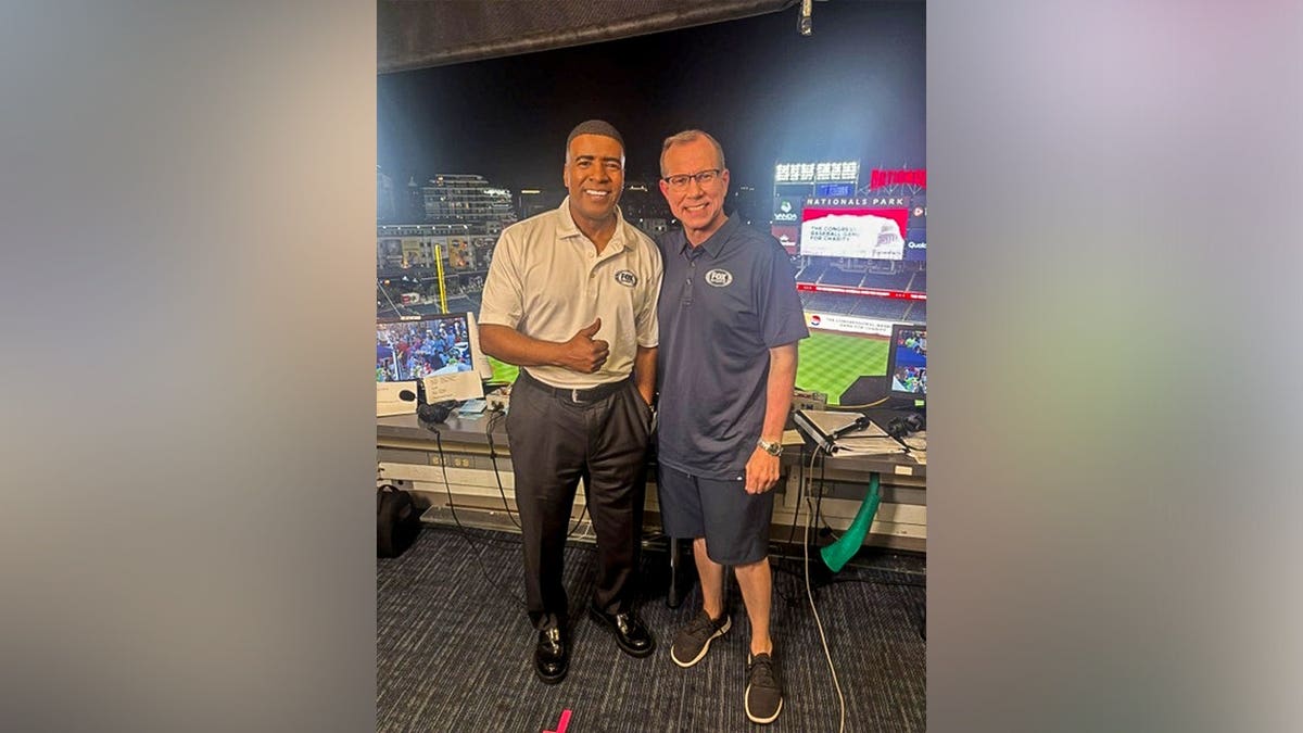 Chad Pergram posing for a photo at a baseball stadium.
