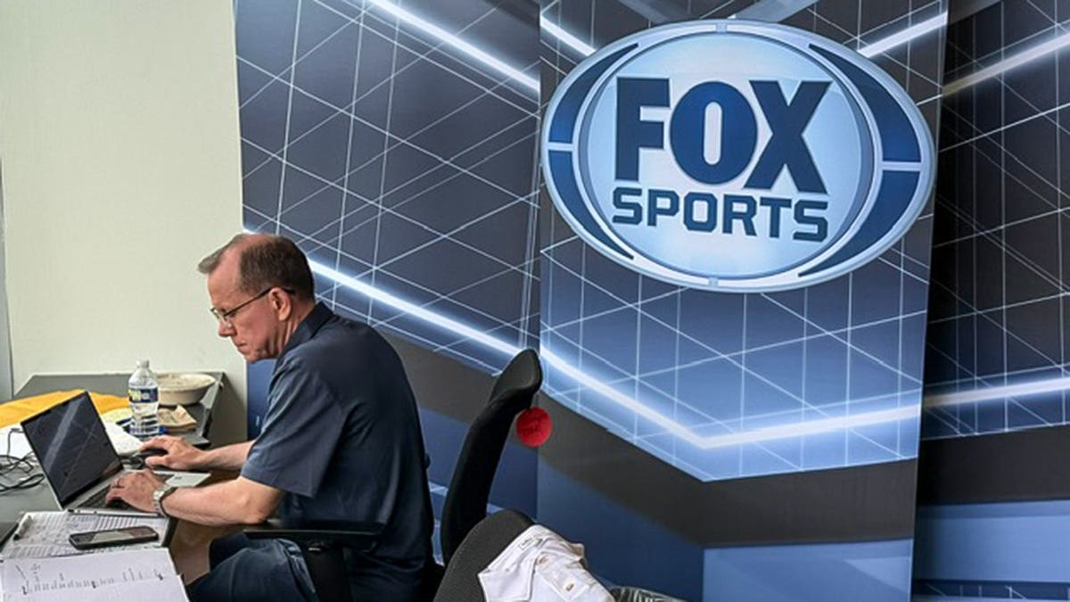 Chad Pergram sitting at his desk at Fox Sports.