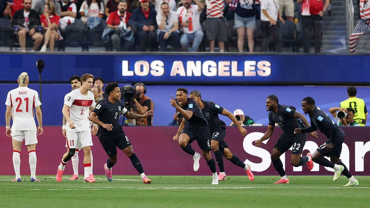 Auston Trusty celebrating pinch teammates aft scoring a extremity astatine Los Angeles Stadium.