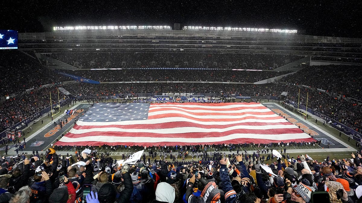 American flag displayed on the field at Soldier Field in Chicago