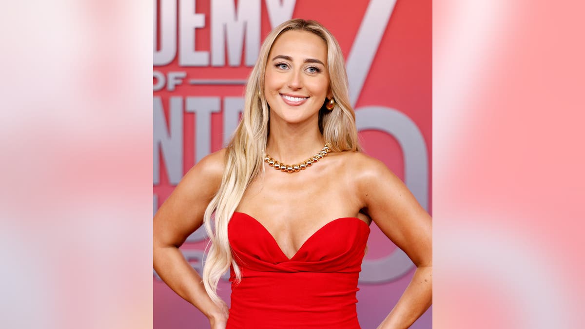 Ashley Cooke standing in a black dress at the 60th Academy of Country Music Awards in Frisco, Texas