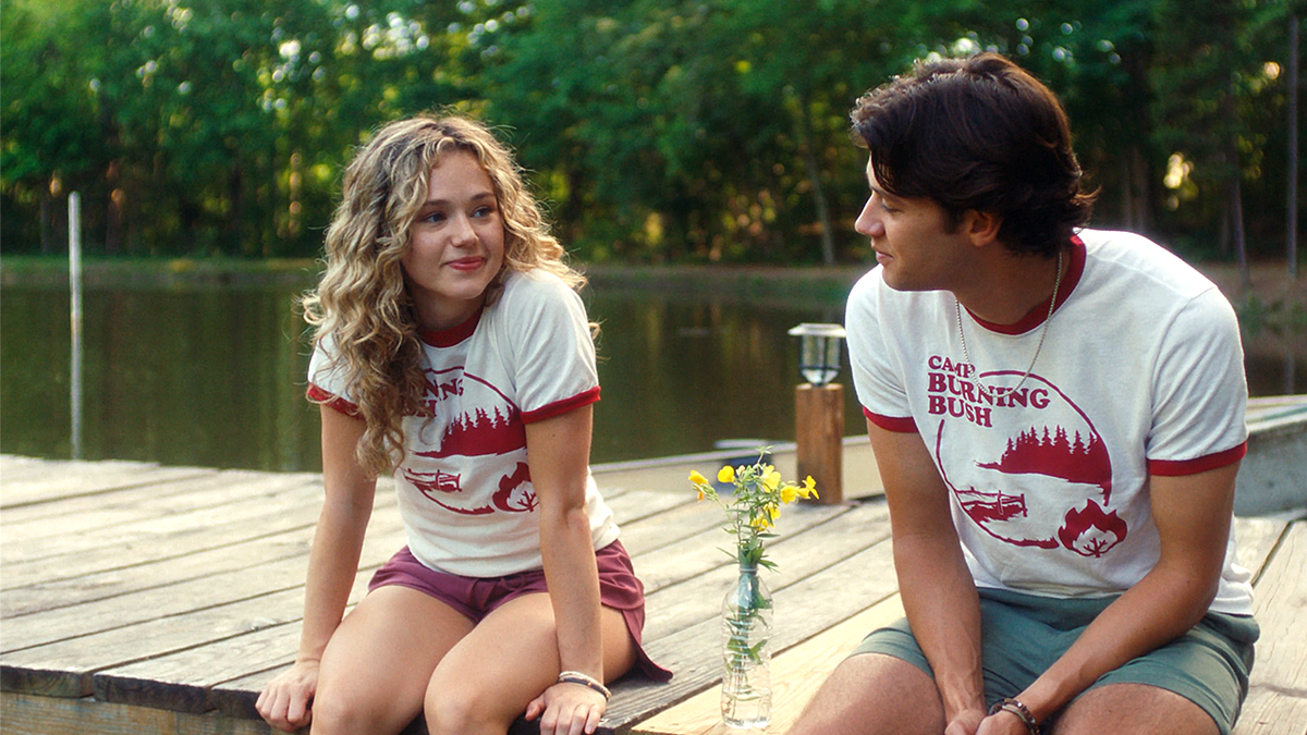 Two camp counselors sit on dock in film 'Bad Counselors'