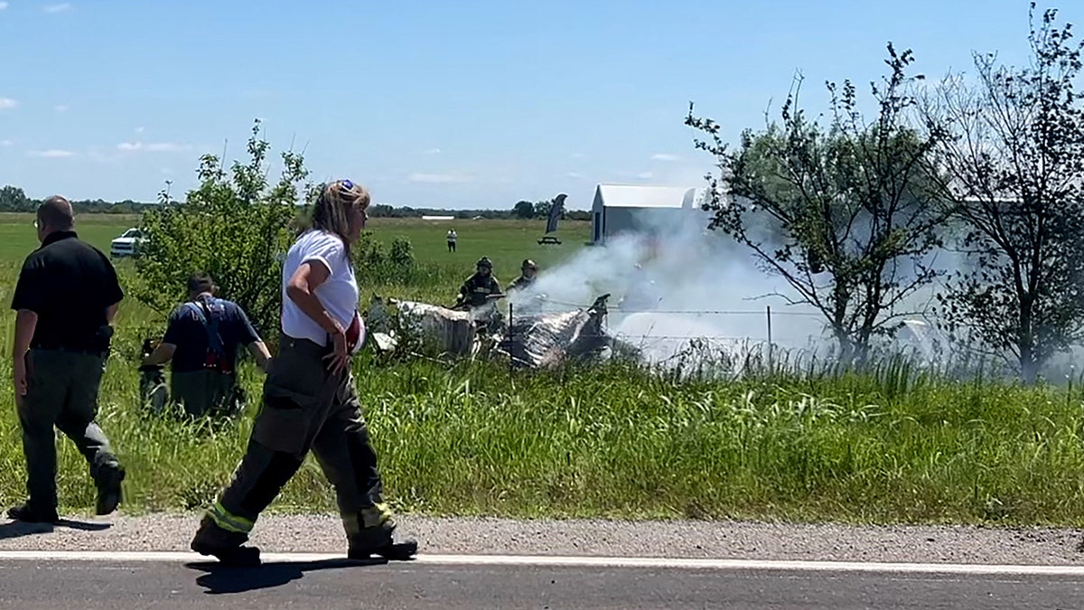 Firefighters attend to crash site