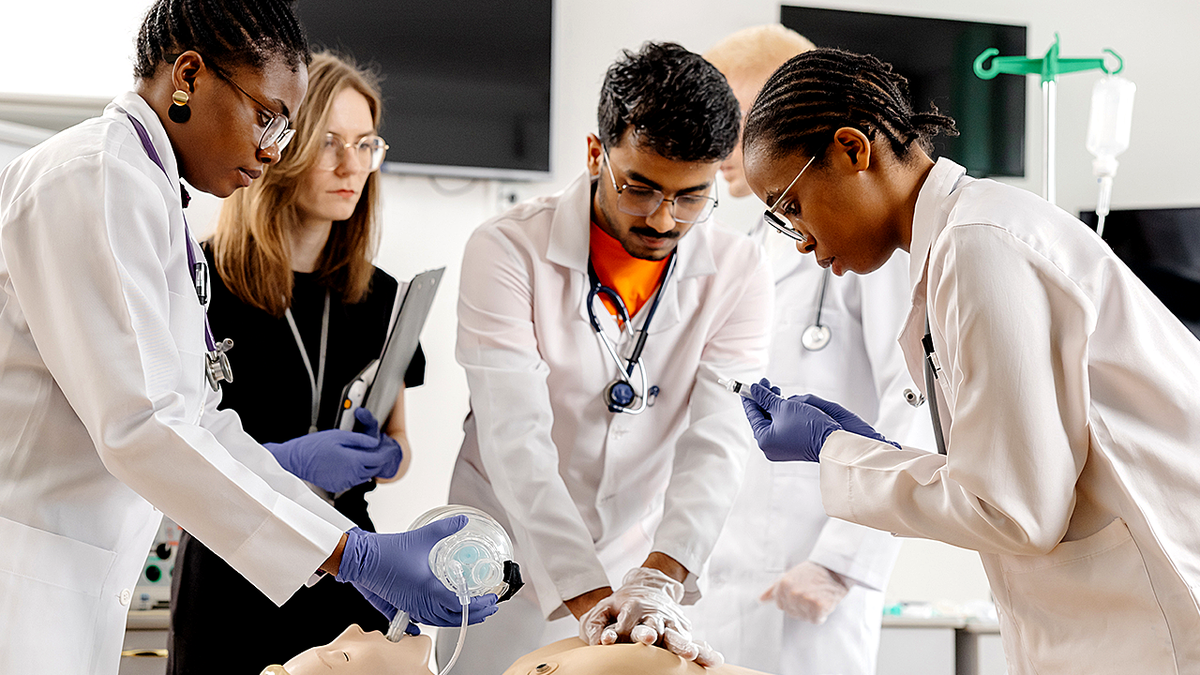 medical school students practicing