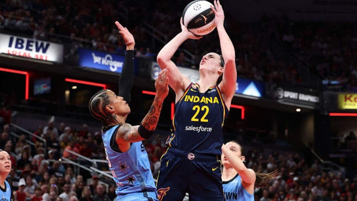 Caitlin Clark shoots over Chicago Sky defender Natasha Cloud during matchup at Gainbridge Fieldhouse. (Photo by Andy Lyons/Getty Images)