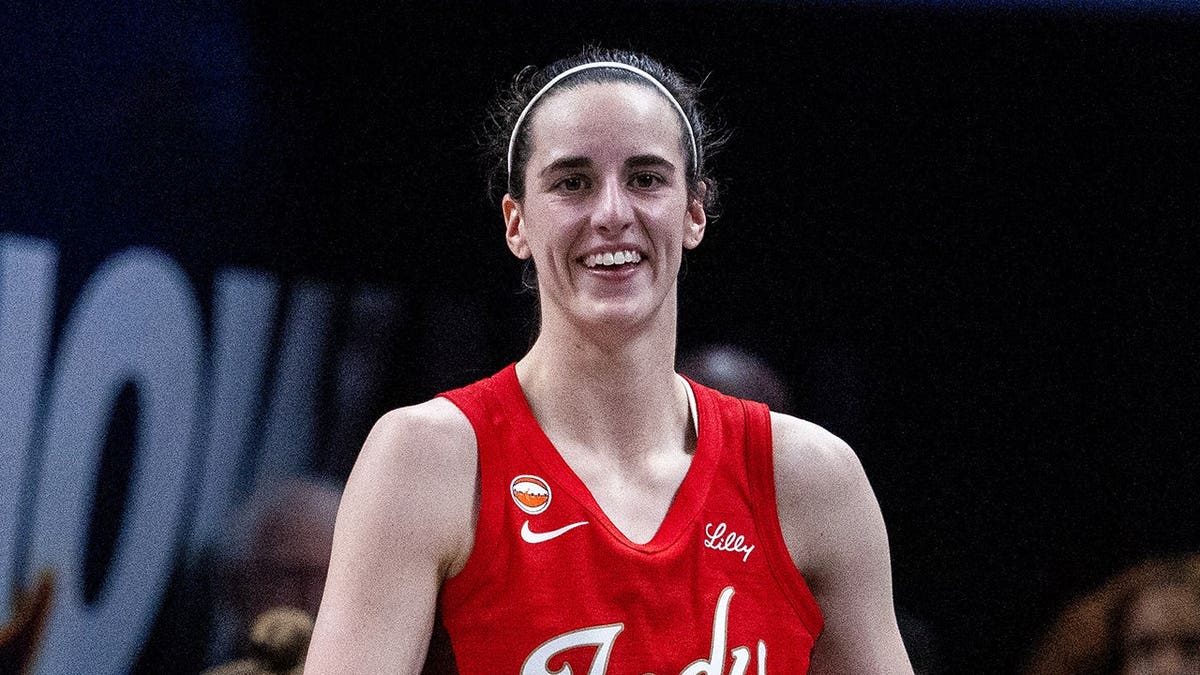 Indiana Fever guard Caitlin Clark reacting to a foul during a basketball game at Gainbridge Fieldhouse