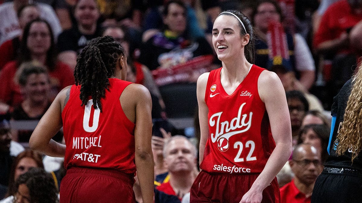 Indiana Fever guard Caitlin Clark looking on during basketball game at Gainbridge Fieldhouse