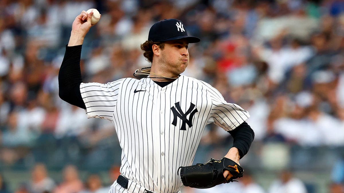 New York Yankees pitcher Cam Schlittler throws a pitch during a baseball game.