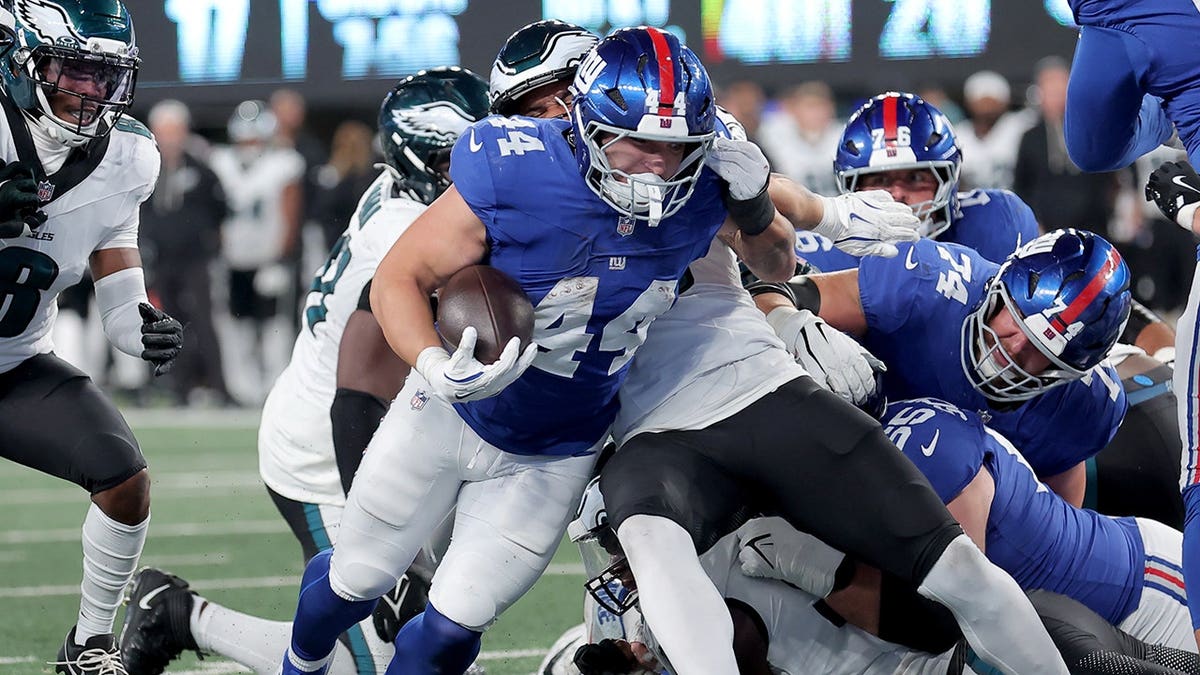 New York Giants running back Cam Skattebo running with the ball at MetLife Stadium