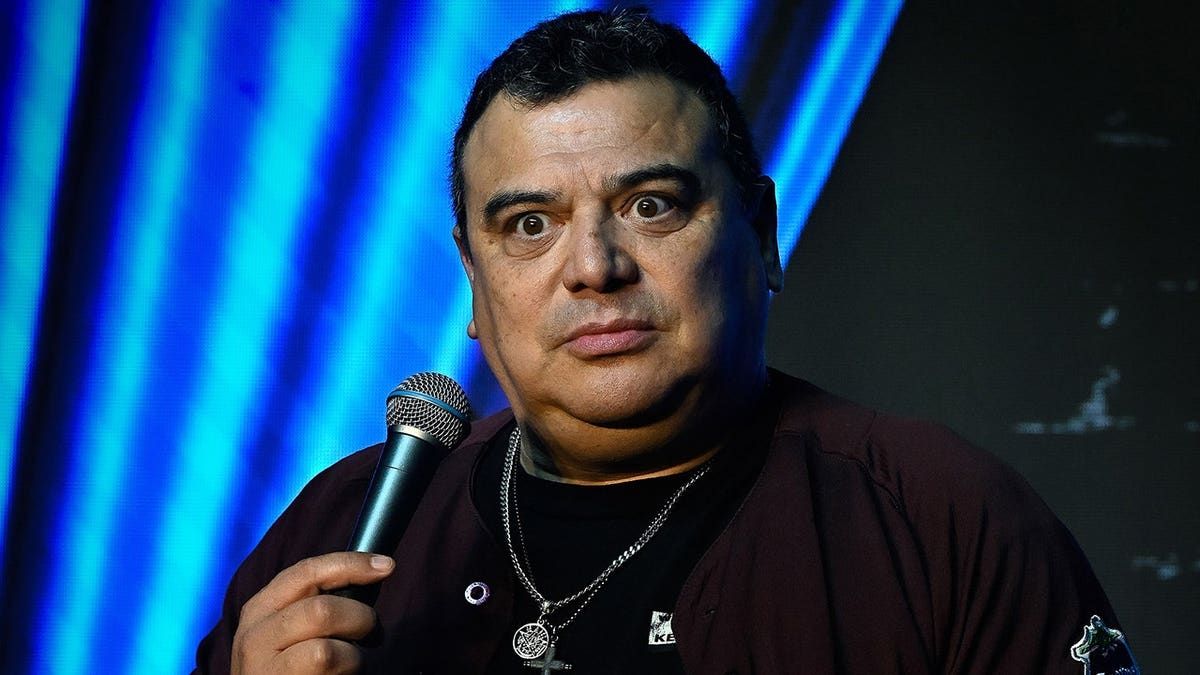 Comedian Carlos Mencia performing on stage at The Ice House Comedy Club in Pasadena, California.