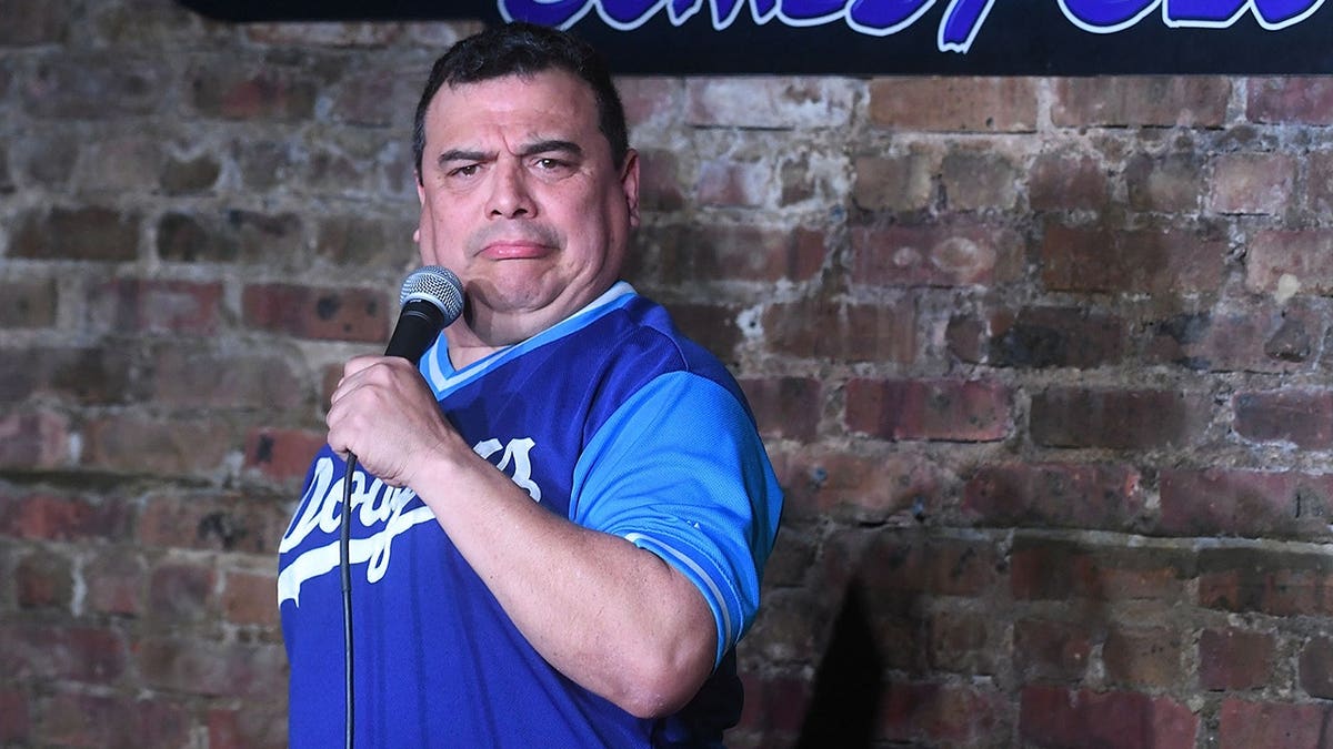 Carlos Mencia performing on stage at The Stress Factory Comedy Club in New Brunswick, New Jersey