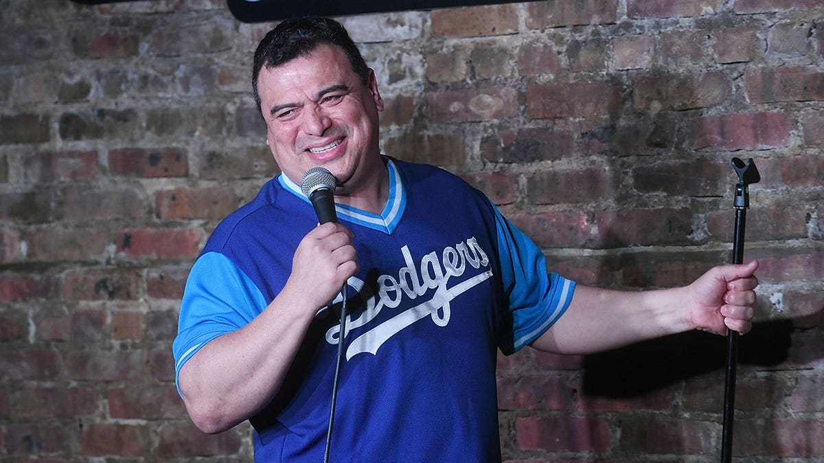 Carlos Mencia performing on stage at The Stress Factory Comedy Club in New Brunswick, New Jersey