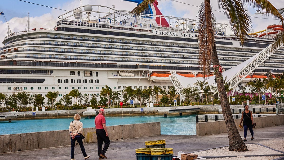 The Carnival Vista cruise ship docked at a port in Nassau, Bahamas.