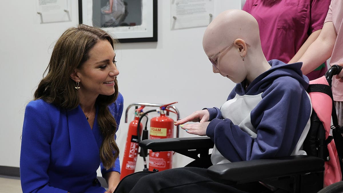 Catherine Princess of Wales seated in a hospital room at the Christie cancer care hospital.