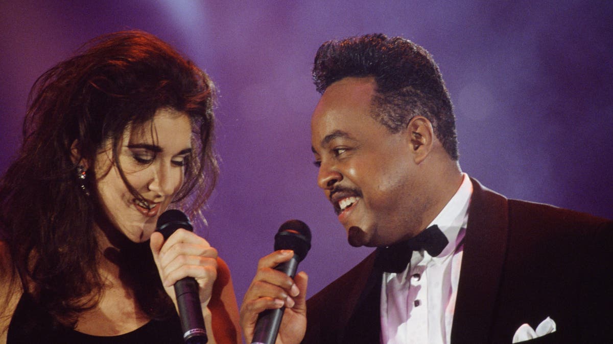 Celine Dion and Peabo Bryson standing together at an event