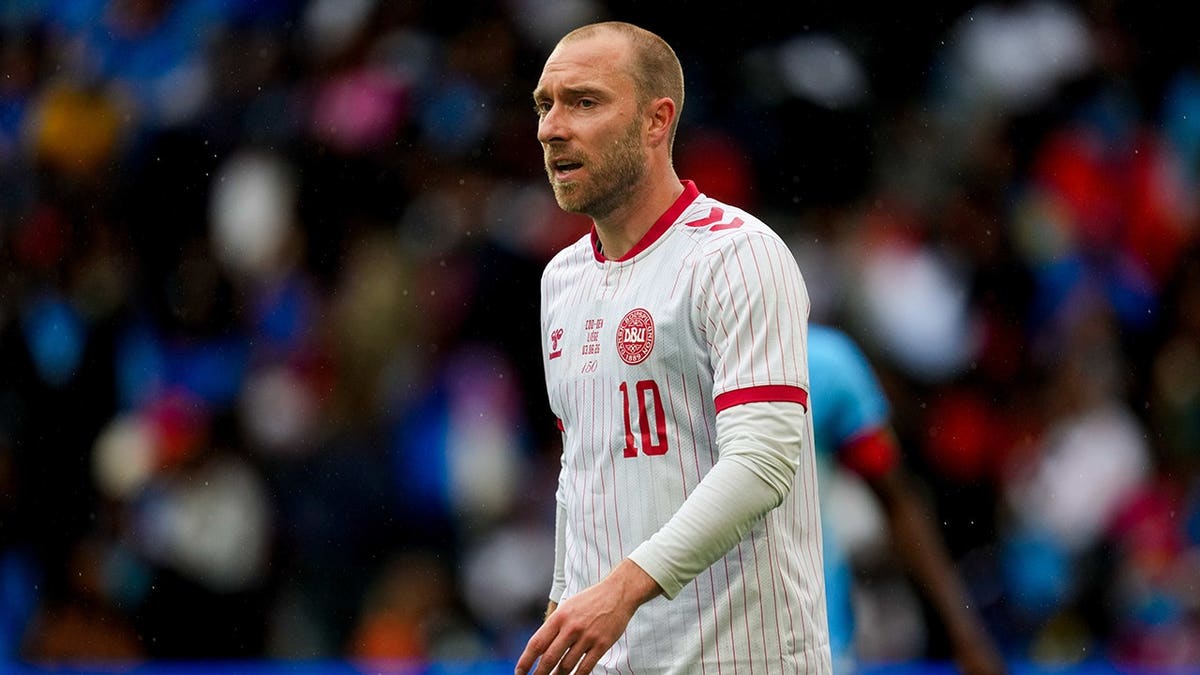 Christian Eriksen looking on during a soccer match at Stade Maurice Dufrasne in Liege Belgium
