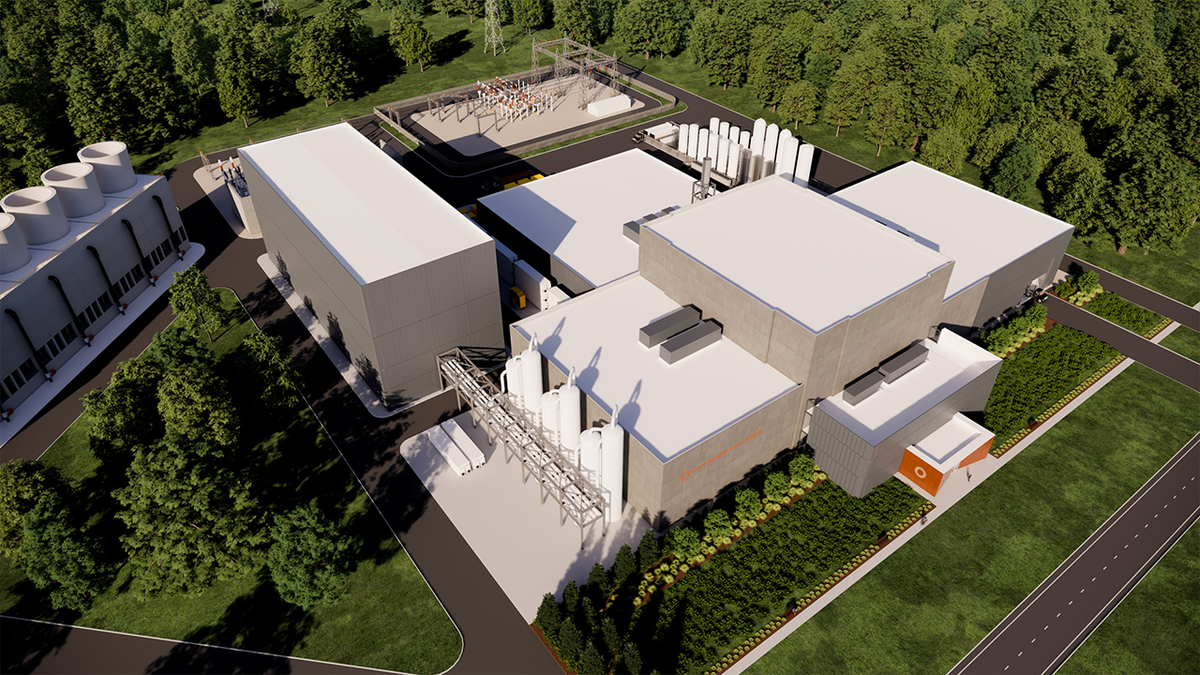 Aerial rendering of a commercial fusion power plant campus with industrial buildings, cooling systems, electrical infrastructure, and surrounding green space.