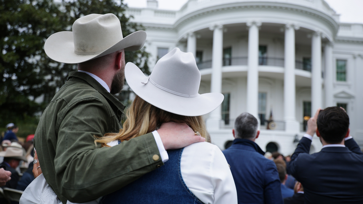 Attendees listen as U.S. President Donald Trump speaks during an event with farmers on the South Lawn of the White House on March 27, 2026 in Washington.