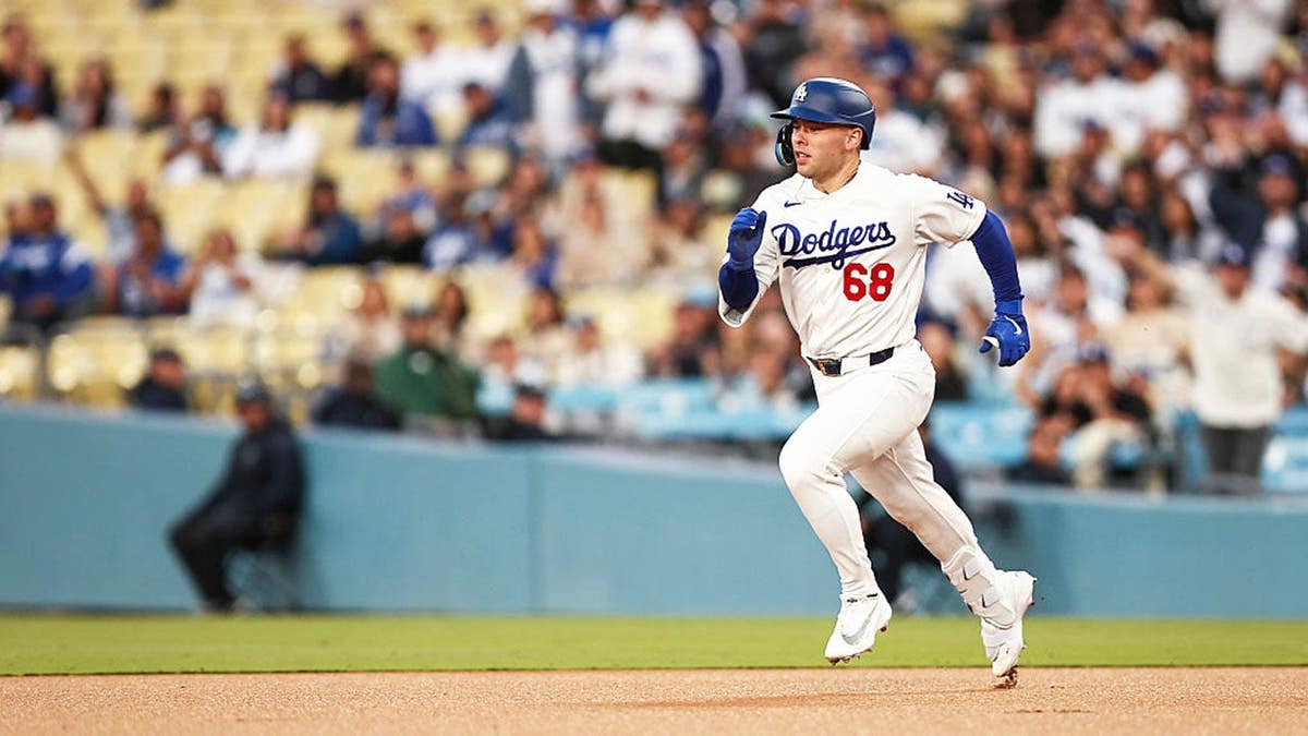 Dalton Rushing reaching second base at Dodger Stadium in Los Angeles