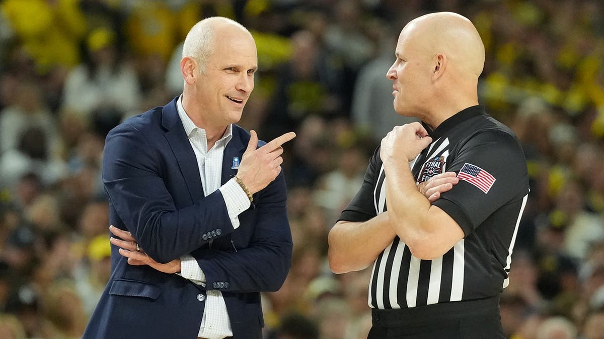 Connecticut Huskies caput manager Dan Hurley talking with an authoritative astatine Lucas Oil Stadium.