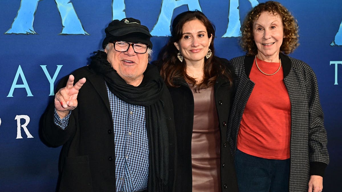 Danny DeVito and Rhea Pearlman with their daughter arriving at a movie premiere in Hollywood