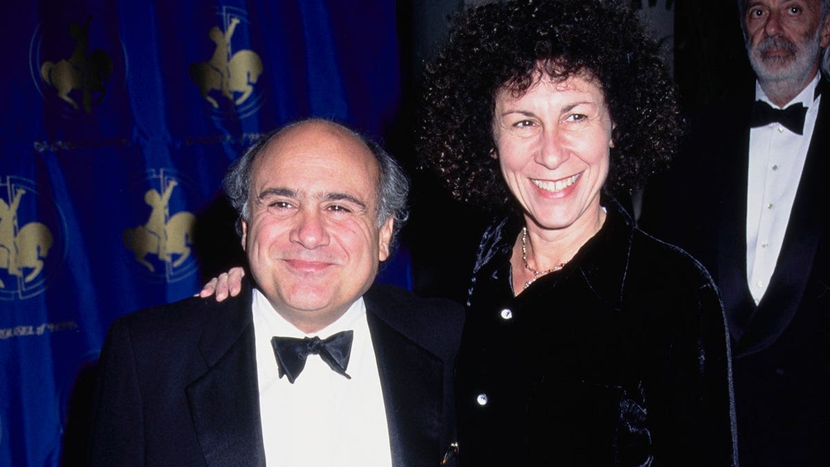 Danny DeVito and Rhea Perlman standing together at an event