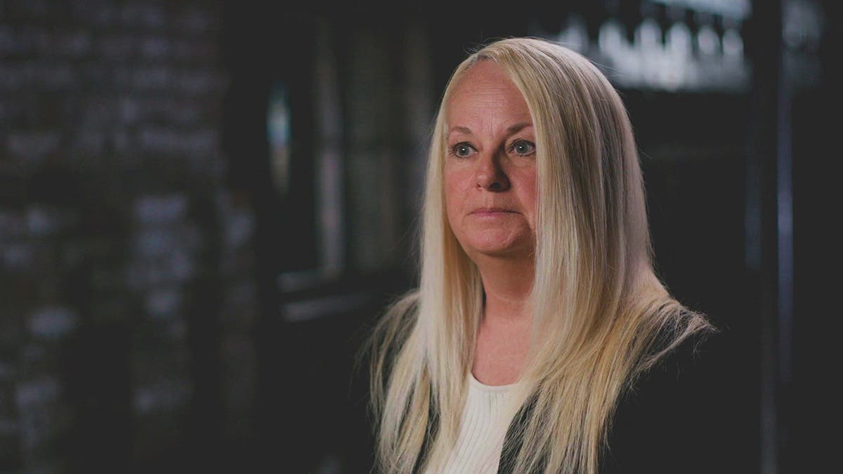 Retired Detective Dawn Mullins sitting during an interview.